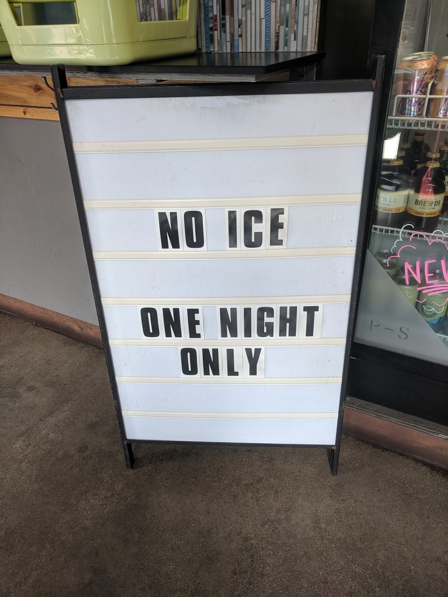 A sandwich board for outside the event that has two lines. Line one: NO ICE. Line two: ONE NIGHT ONLY